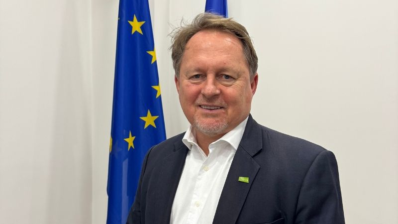 Primoz Vehar Deputy Team Leader Institutional Reforms and Legal Approximation standing in front of EU flag in a suit